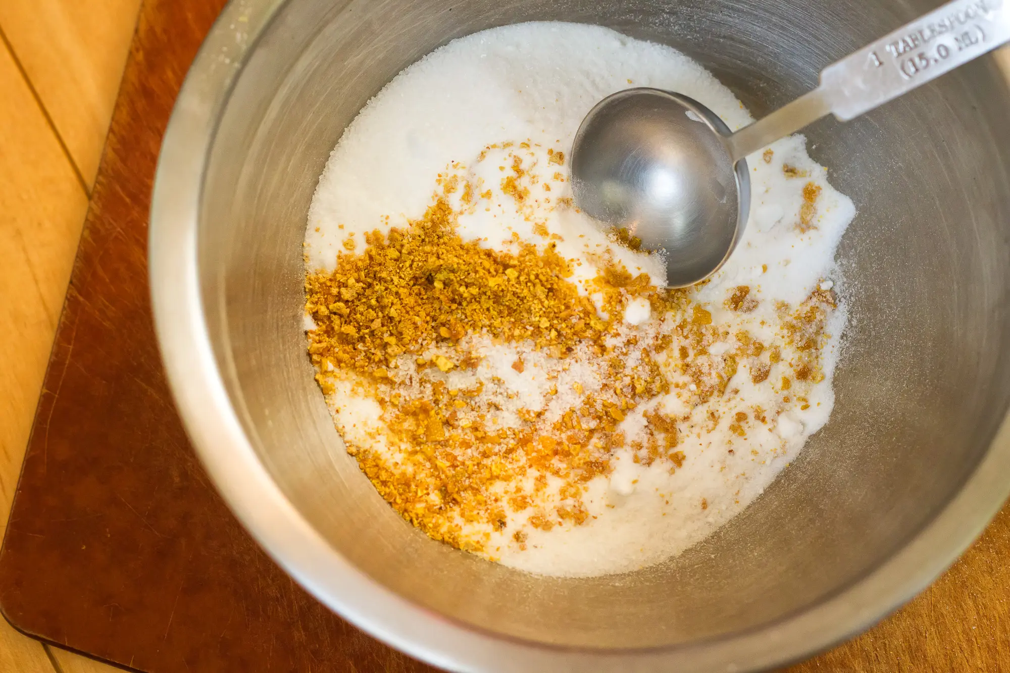 Citrus mix being mixed in a bowl.