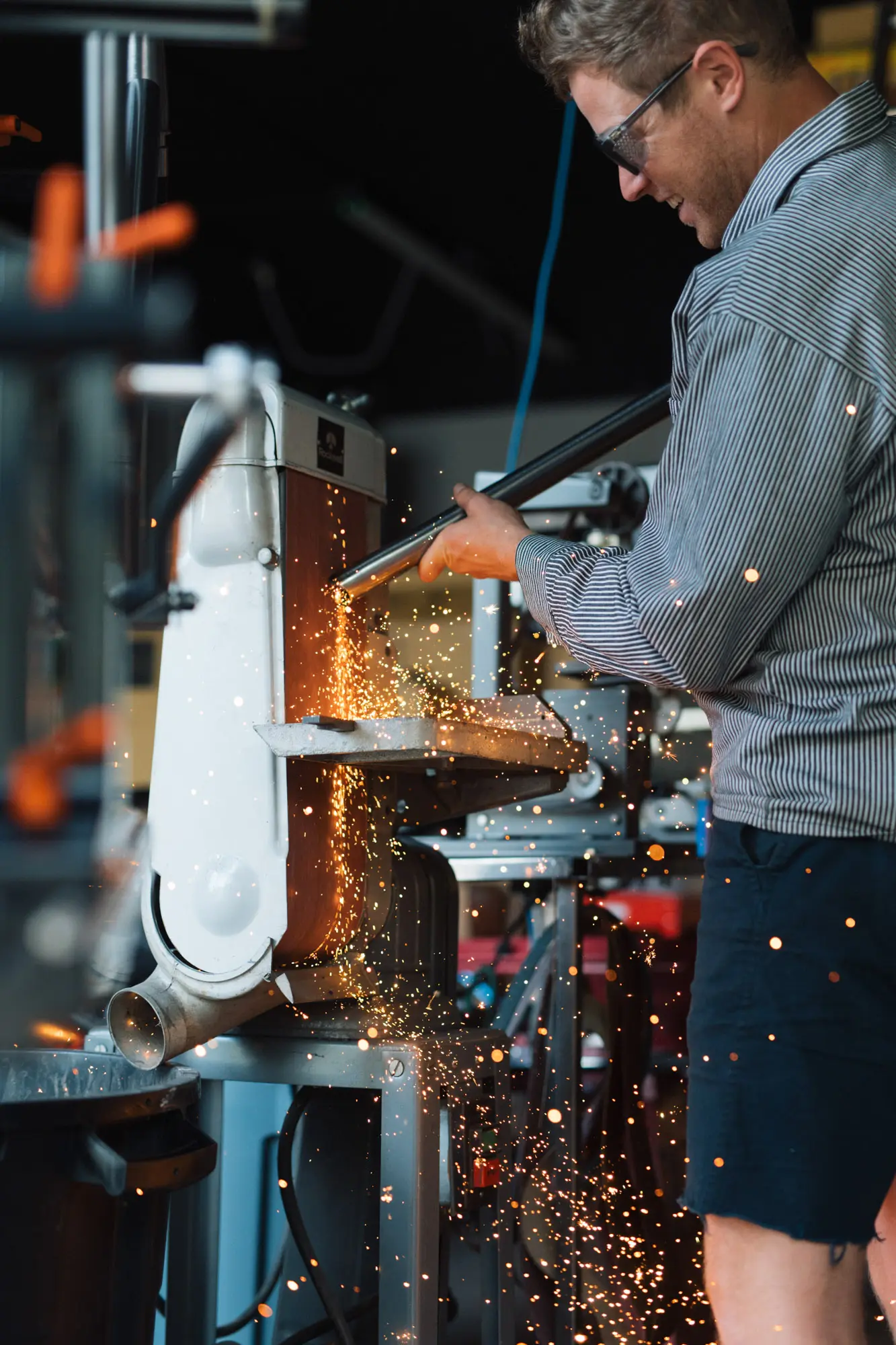 Adam grinds some steel.